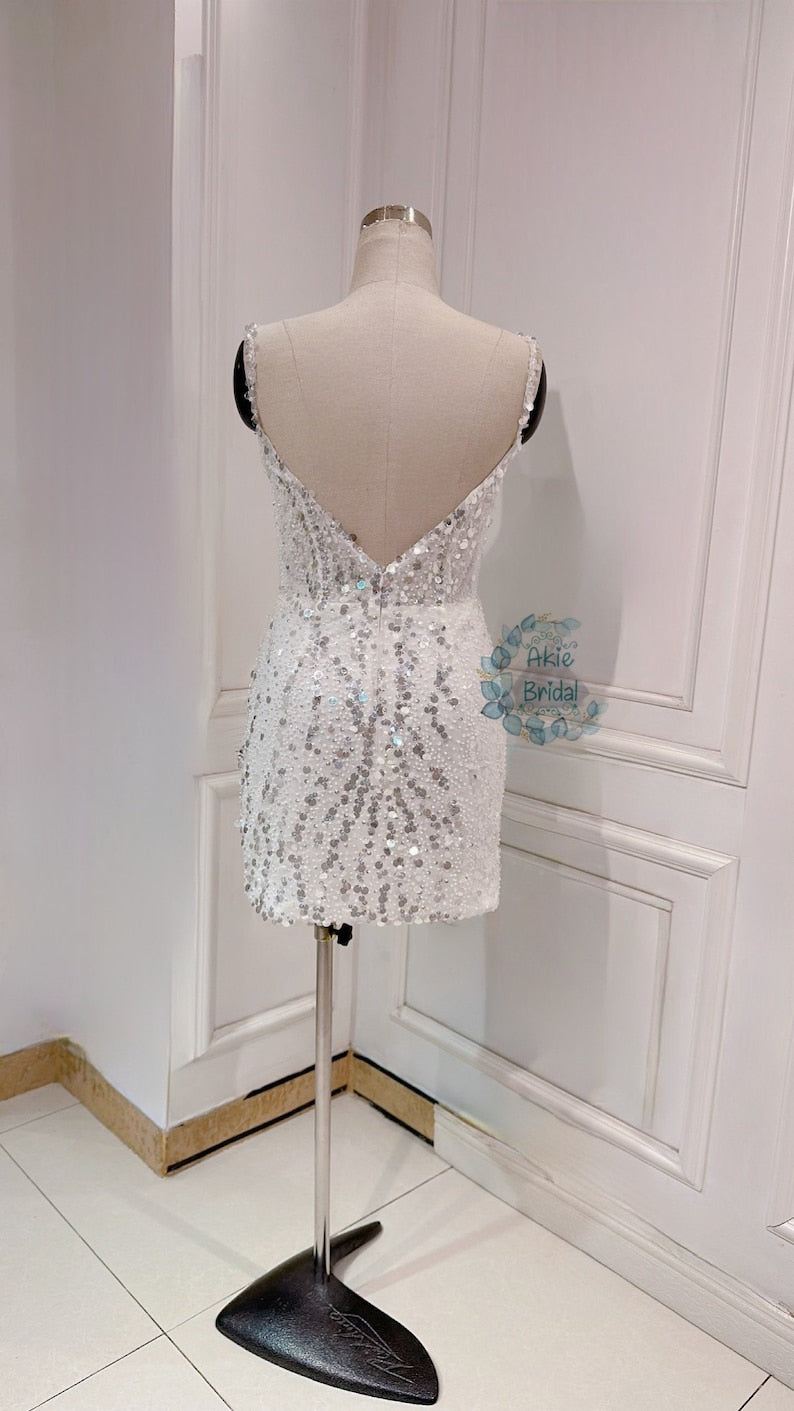 Custom wedding dress for the bride. Sexy V-deep short wedding dress. Beaded mini wedding dress with spaghetti sleeves for the party.