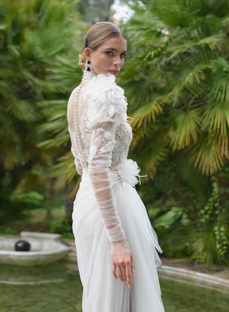 Extravagant Long Ruffled Sleeves Feather decorated Mock-neck High neck Side slit skirt Floor length no train A-line wedding dress