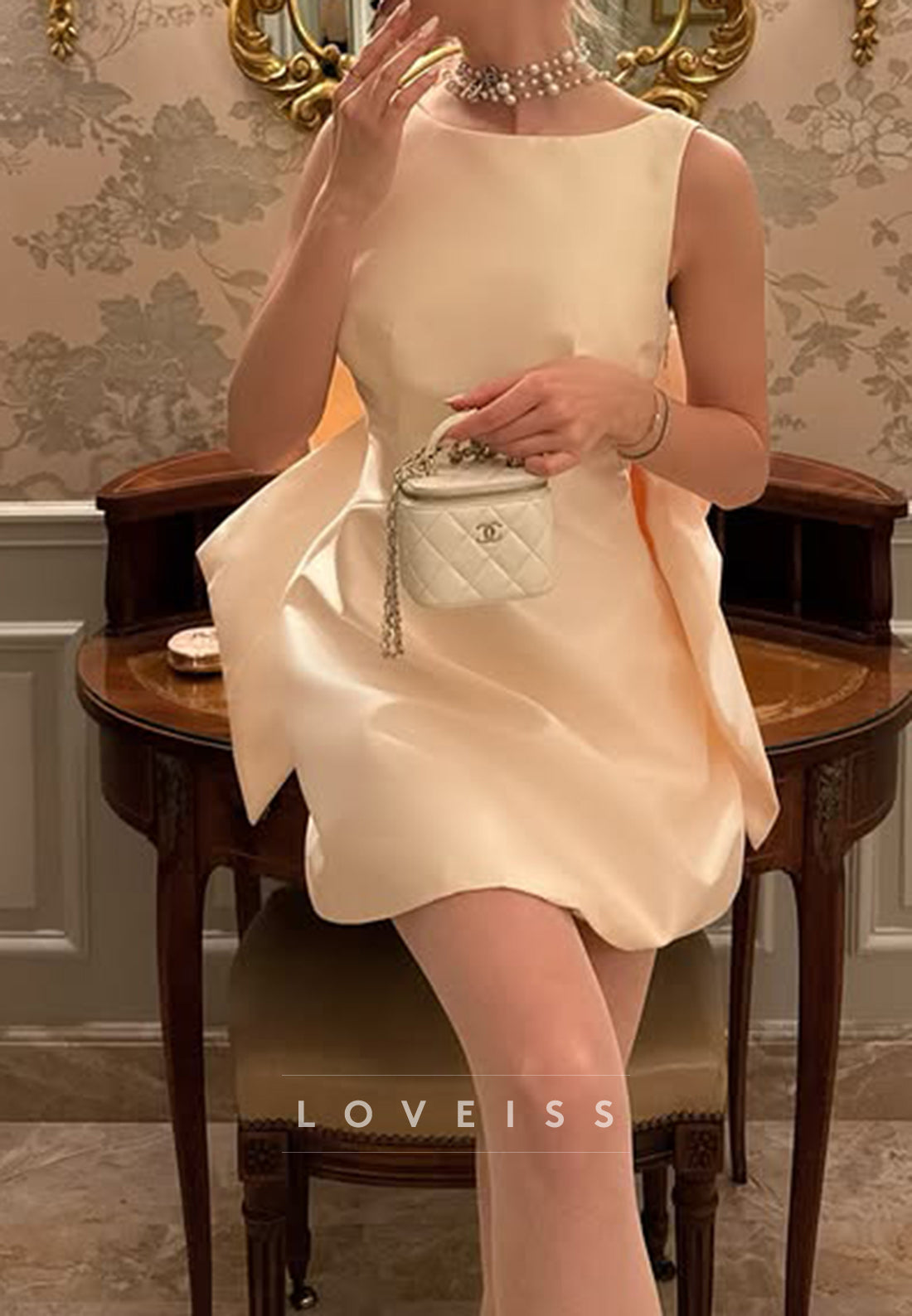 Sleeveless Bateau Mini Dress with Statement Back Bow