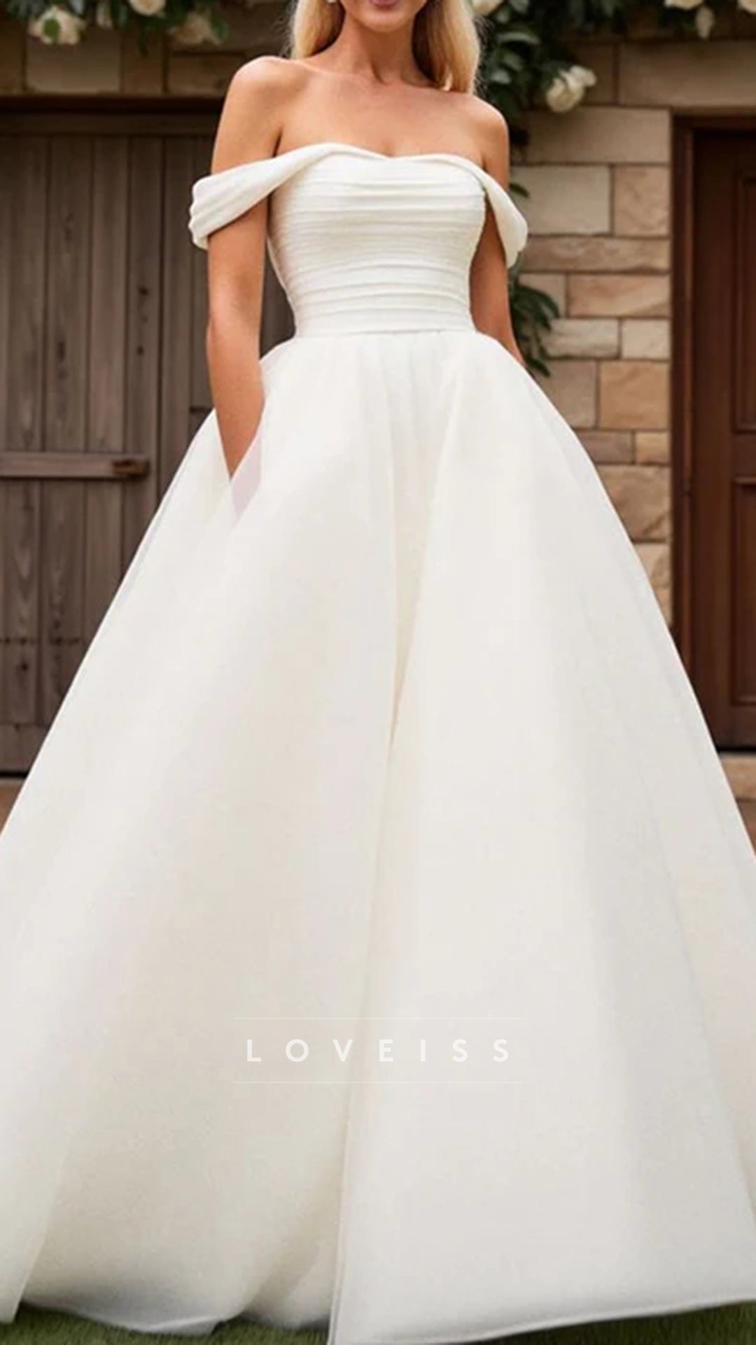 A Line Off The Shoulder Tulle Wedding Dress Pleated