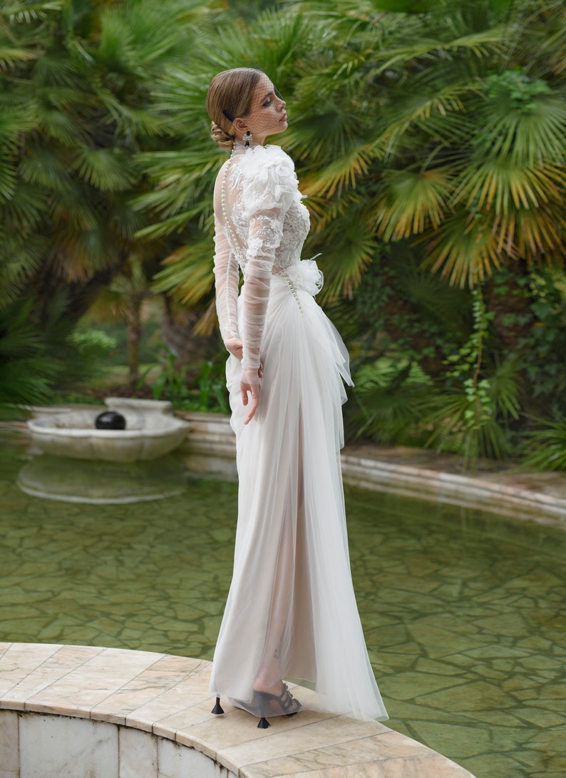 Extravagant Long Ruffled Sleeves Feather decorated Mock-neck High neck Side slit skirt Floor length no train A-line wedding dress
