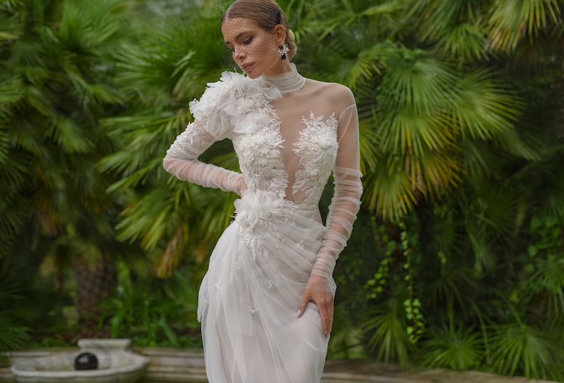Extravagant Long Ruffled Sleeves Feather decorated Mock-neck High neck Side slit skirt Floor length no train A-line wedding dress